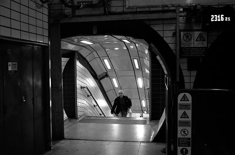 A passenger emerging from a London Underground station.