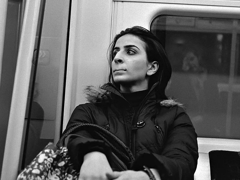 A woman weighing her next move on a London Underground platform.