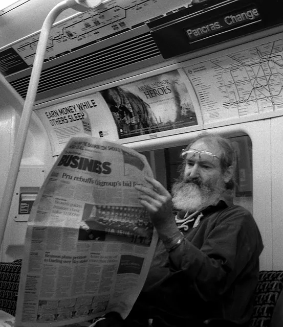 A businessman absorbed in his own concerns on the London Underground.
