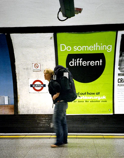 A passenger absorbed in the wider world aboard the London Underground; one of the two colour frames.