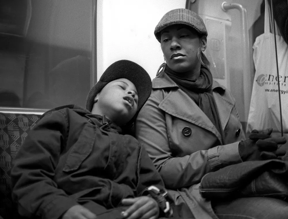 A commuter still travelling on the Underground, not yet home.